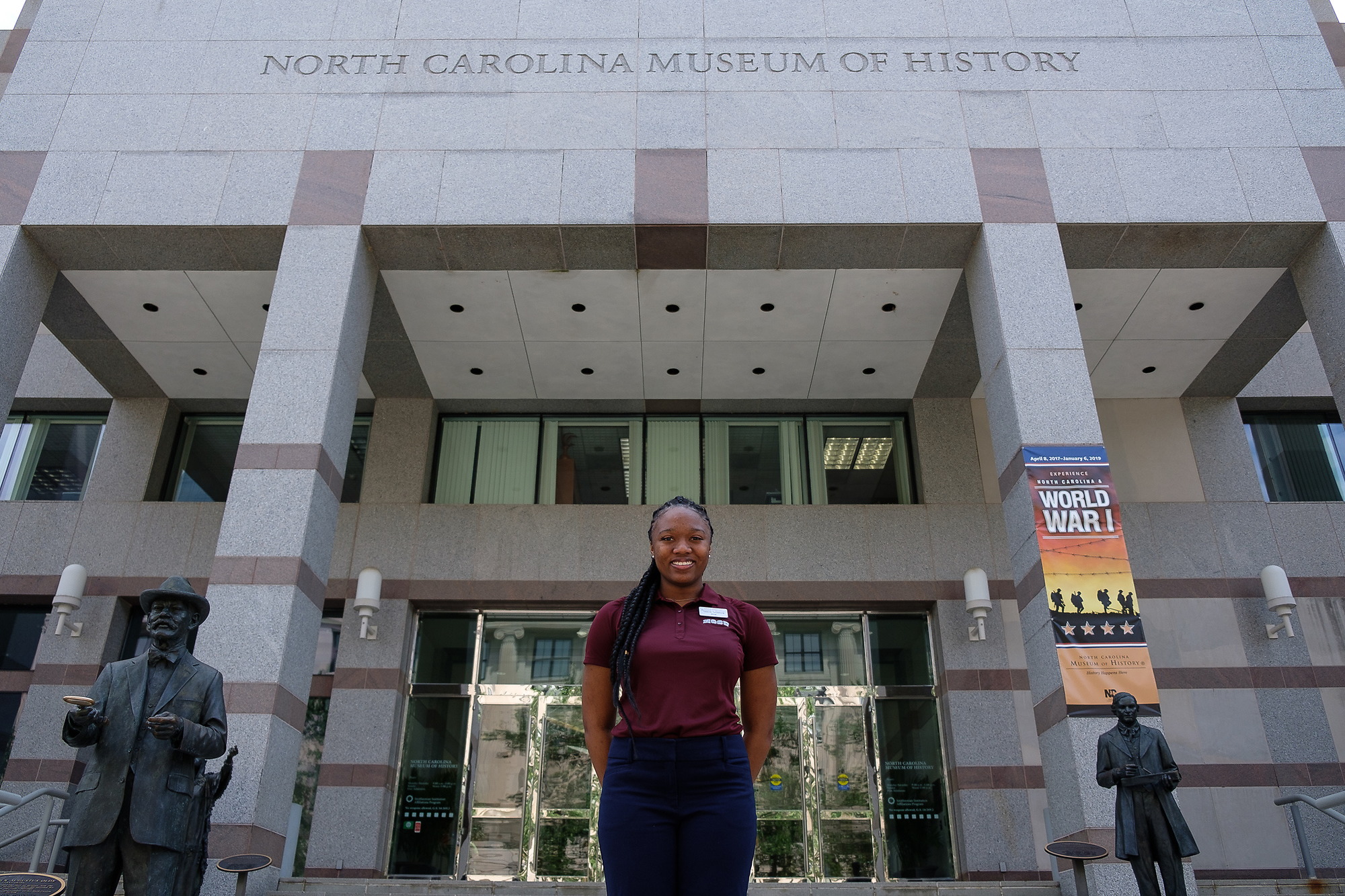 Student is standing in front of History museum