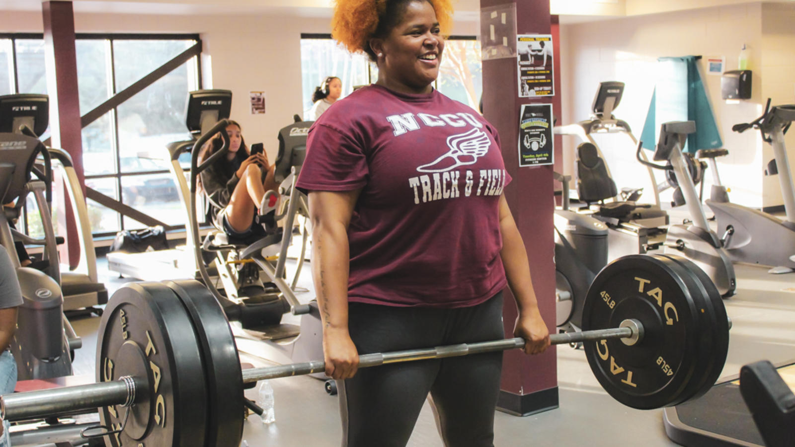 Student lifting weights