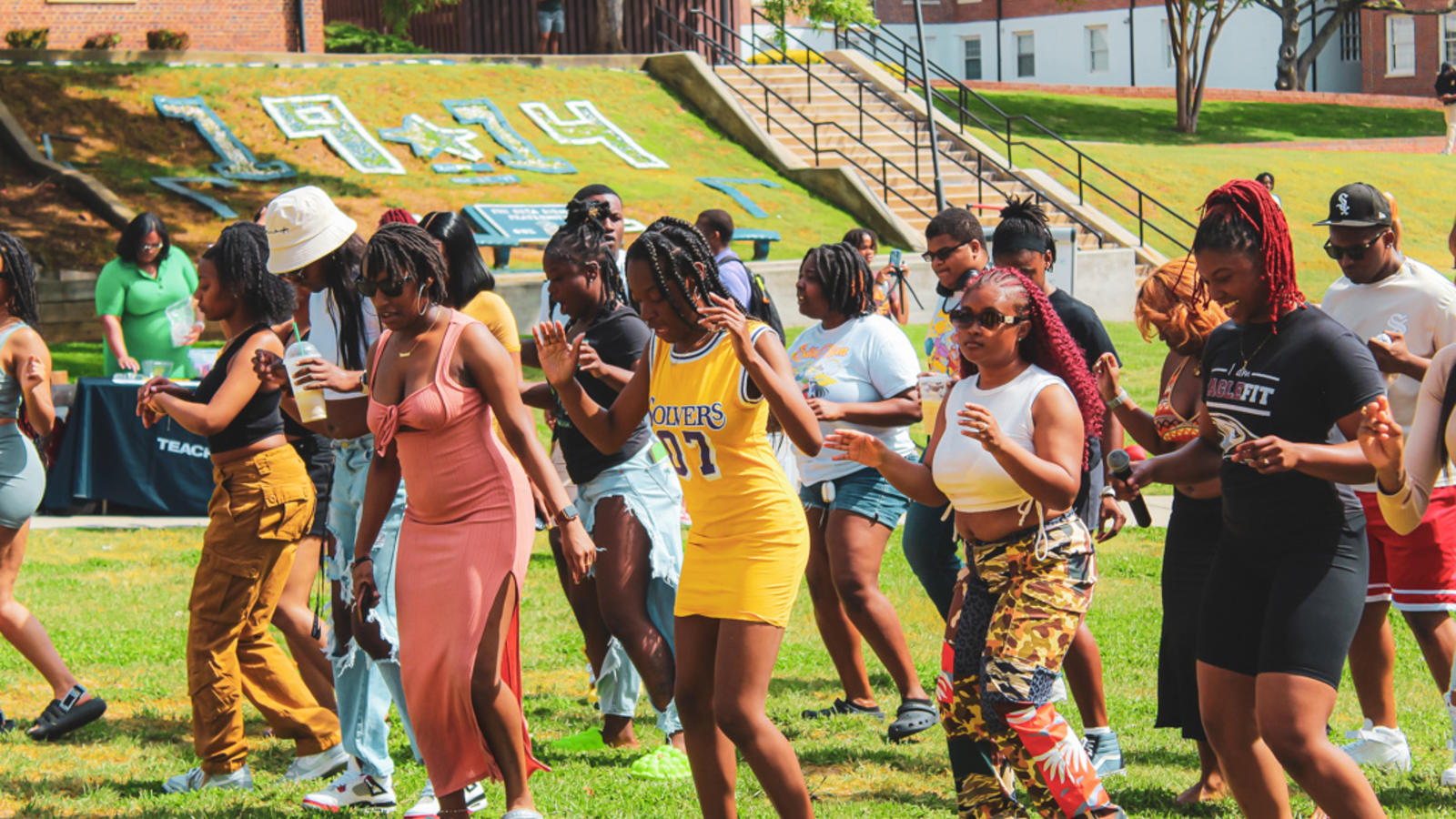 Students dancing on lawn