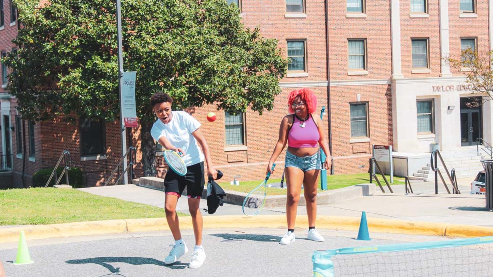 Students playing tennis