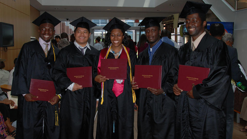 CHAS MAPH Graduates standing with their diplomas
