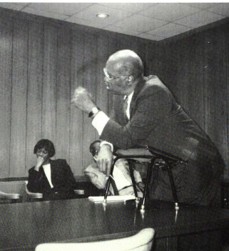 Black and white image of a man in a court room