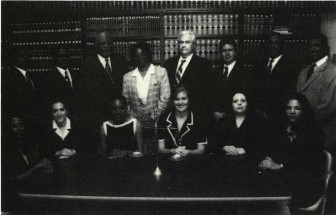 Image of Thomas M. Ringer and colleagues around a table