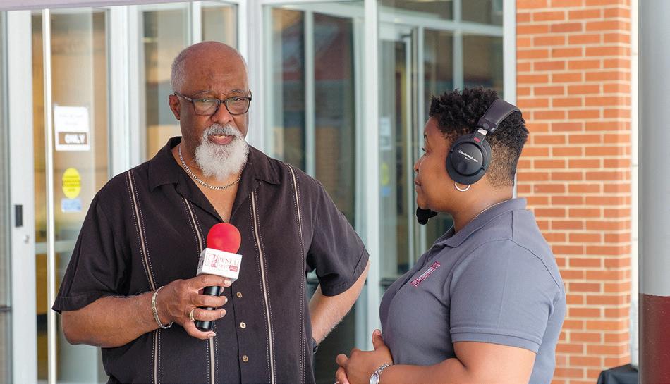 Two people talking with microphone