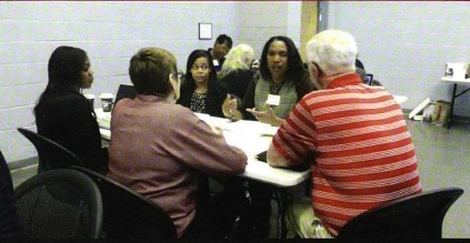 Image of people sitting around a table