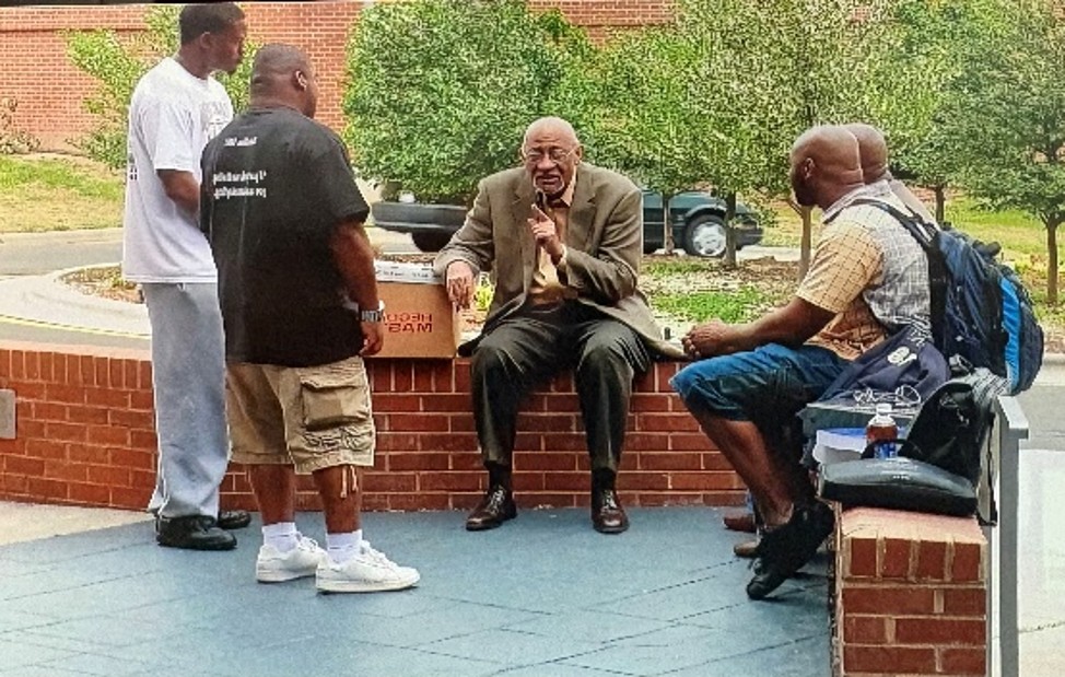 Image of men outside talking