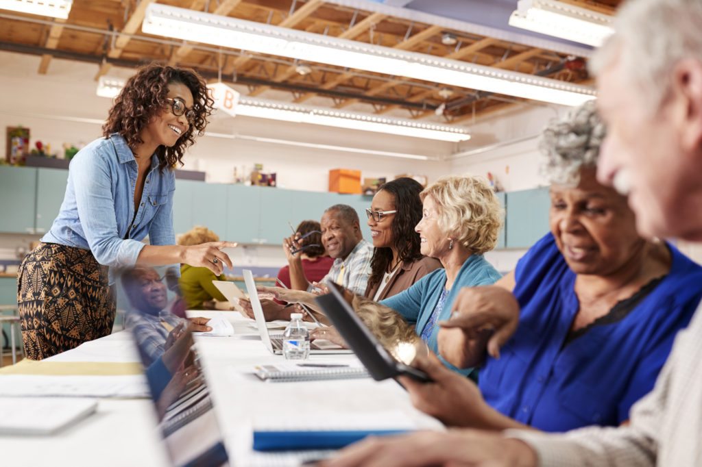 Senior people looking at computers