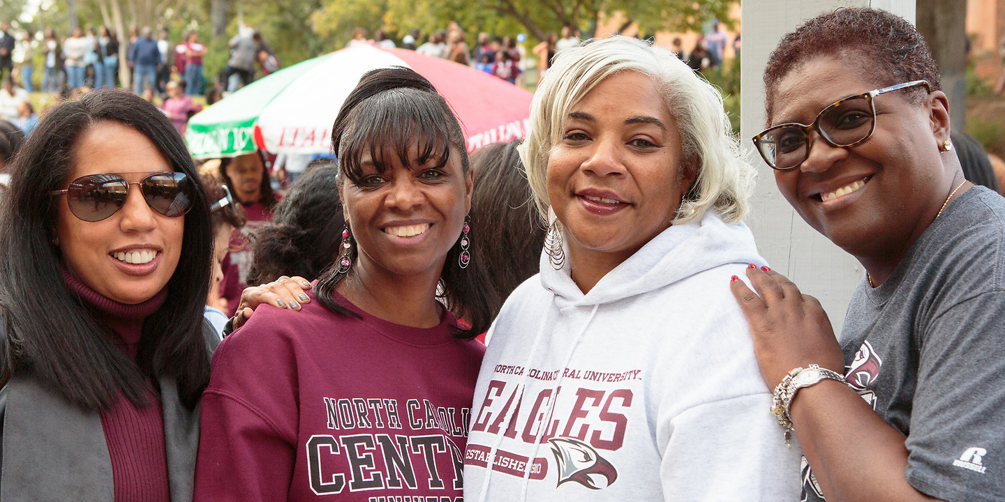 NCCU Alumni smiling at the camera.