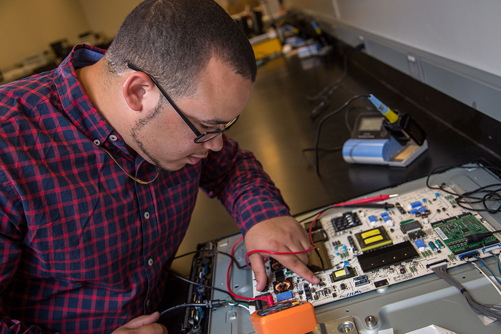 person working on electronics