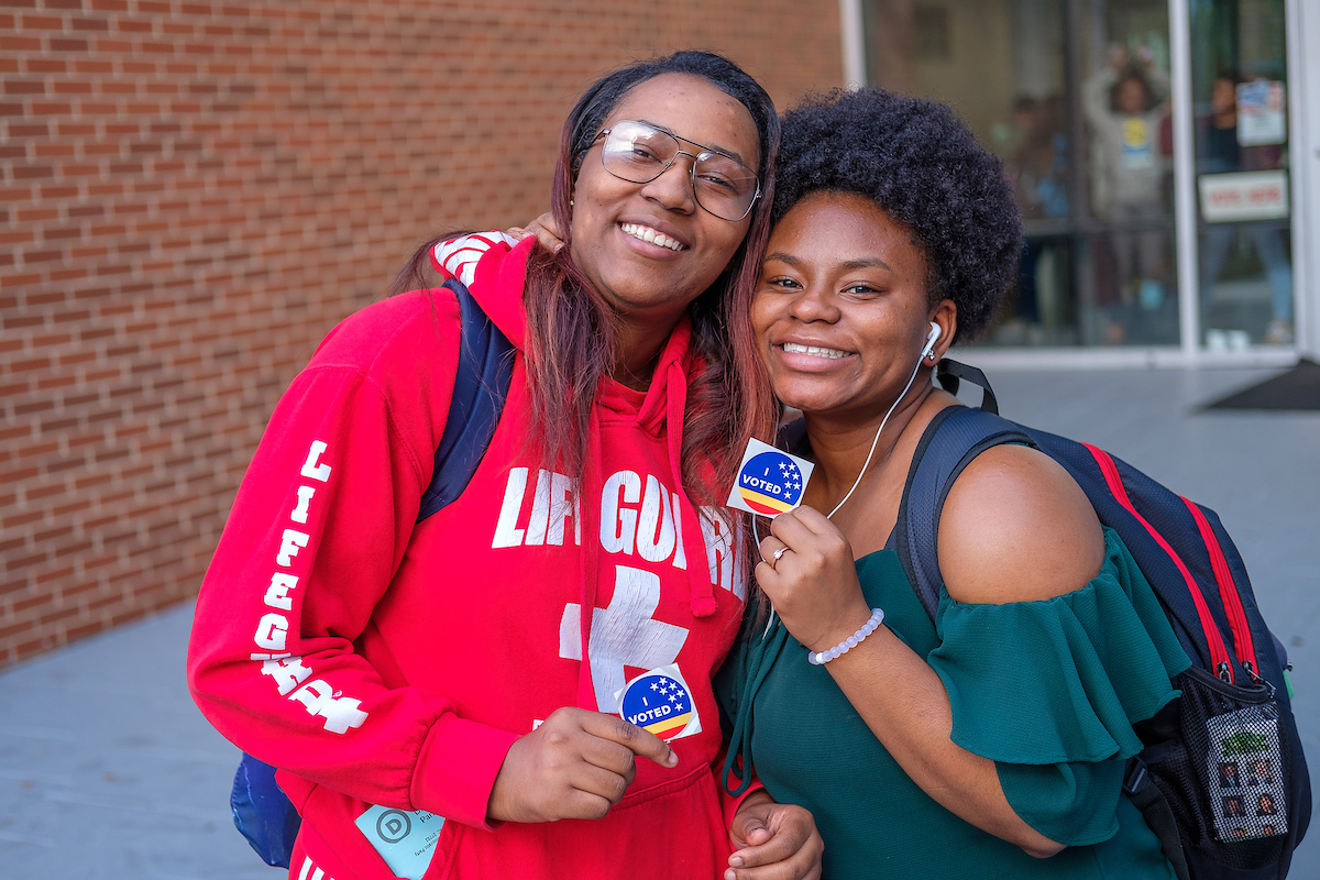 Students Smiling with I Voted Stickers