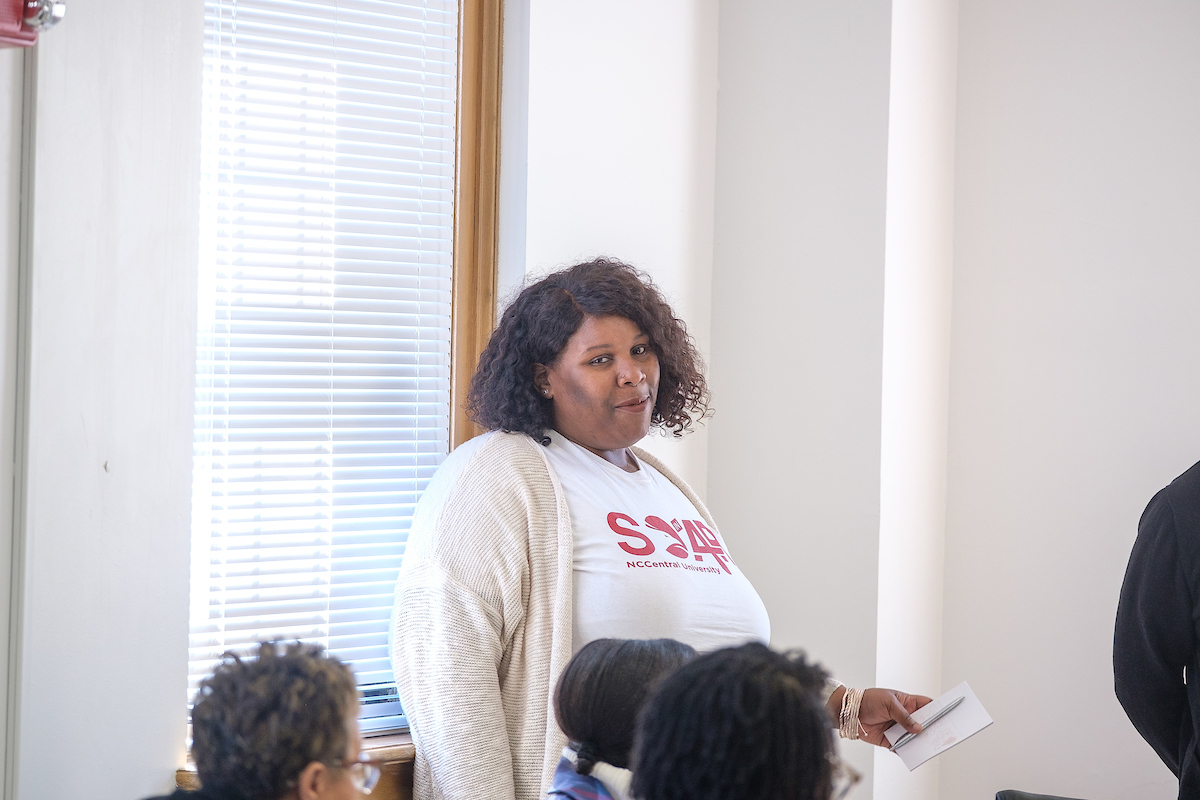 Woman standing in front of students