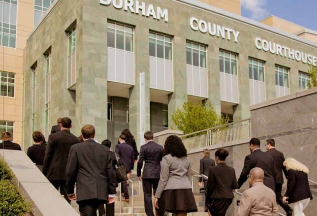 Image of people walking into the Durham County Courthouse