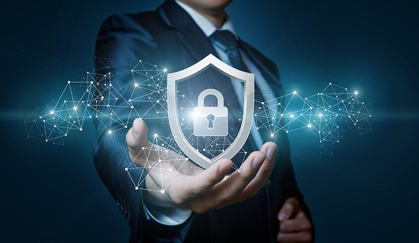 Stock image of man holding a digital shield with a lock symbol inside