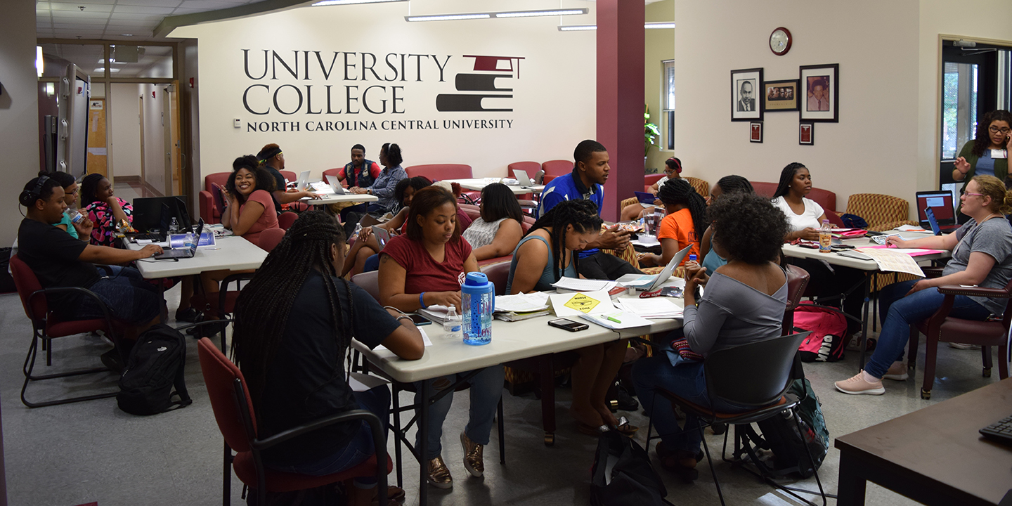 University College Room with students sitting at desks.