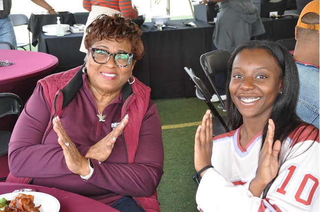 Two women sitting and smiling