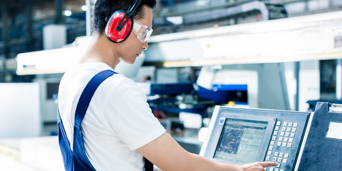 Stock image of a CNC machinist working