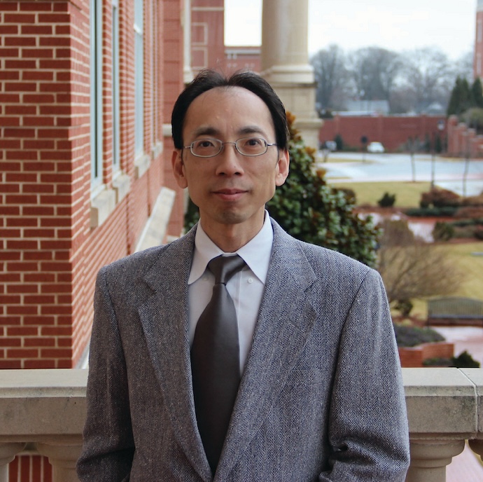 Dr. TinChung Leung in suit