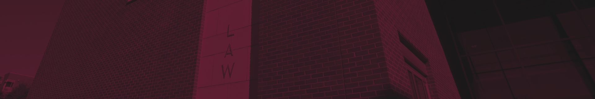 maroon background with the school of law in the background