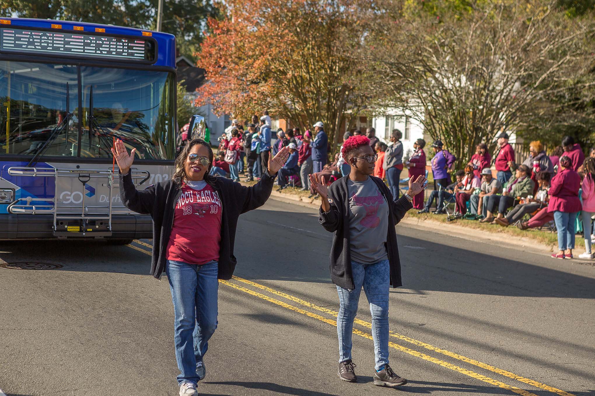 Parade with bus and people