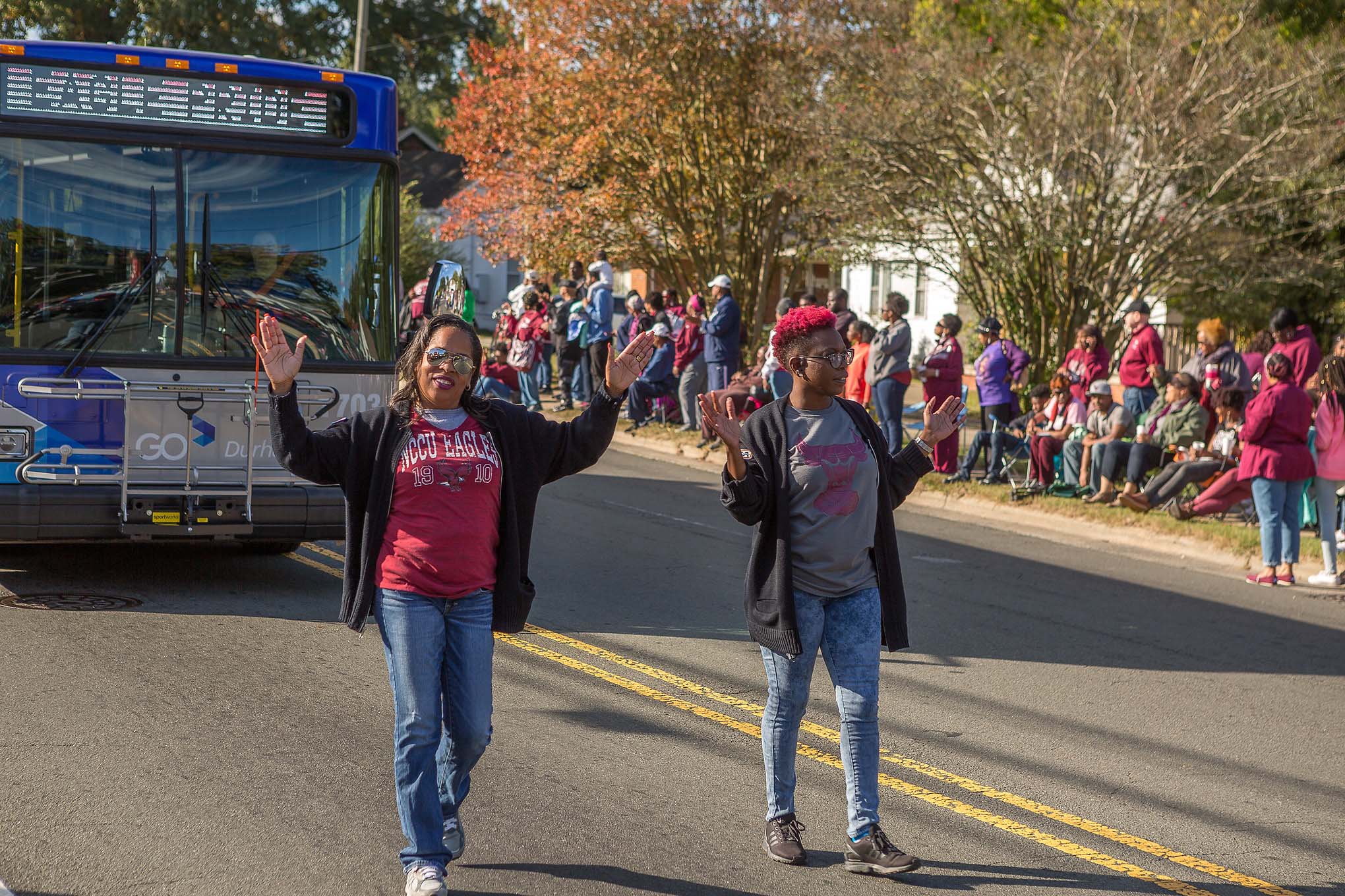 Parade with bus and people