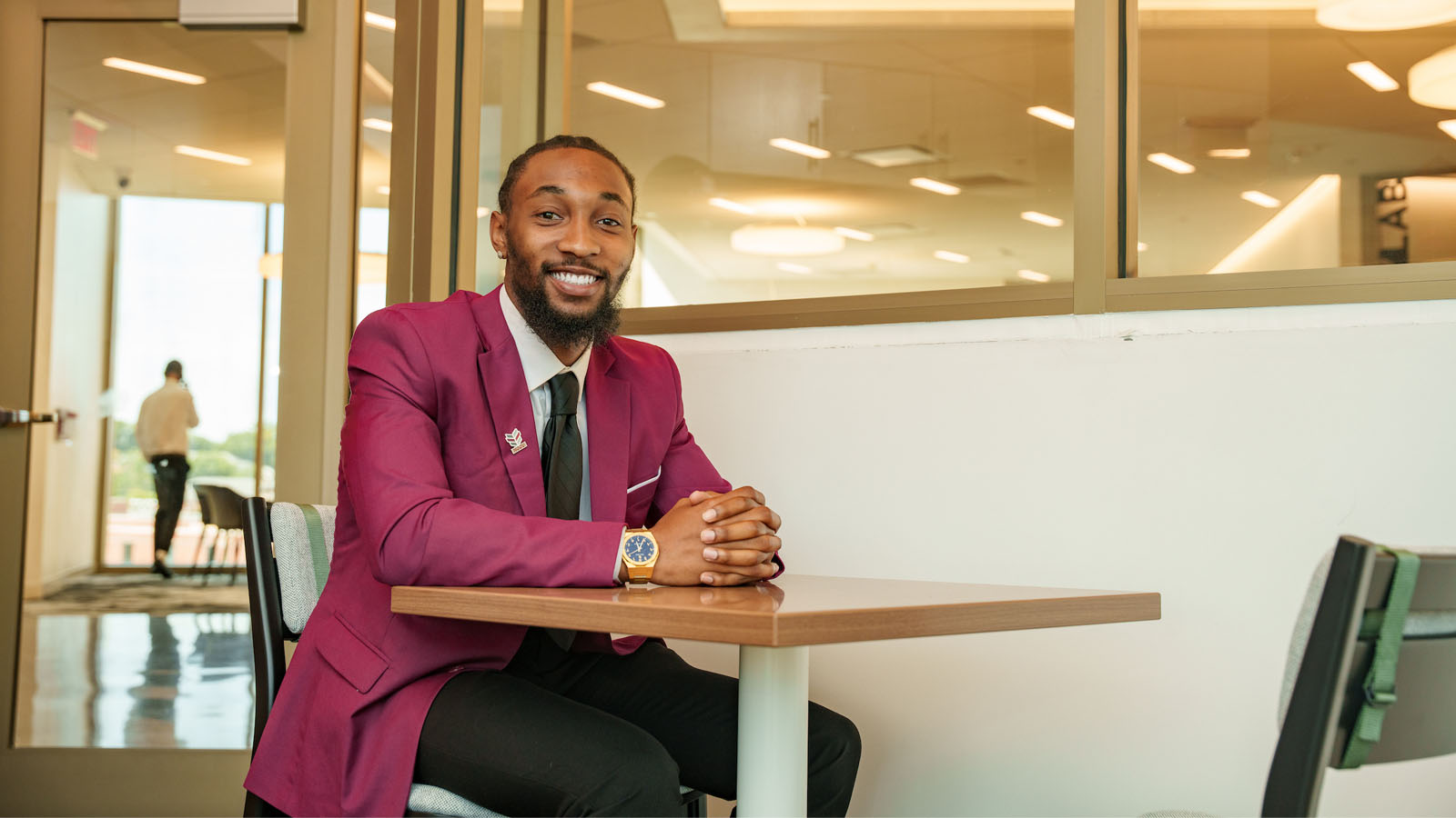 business student in suit, posing for the camera