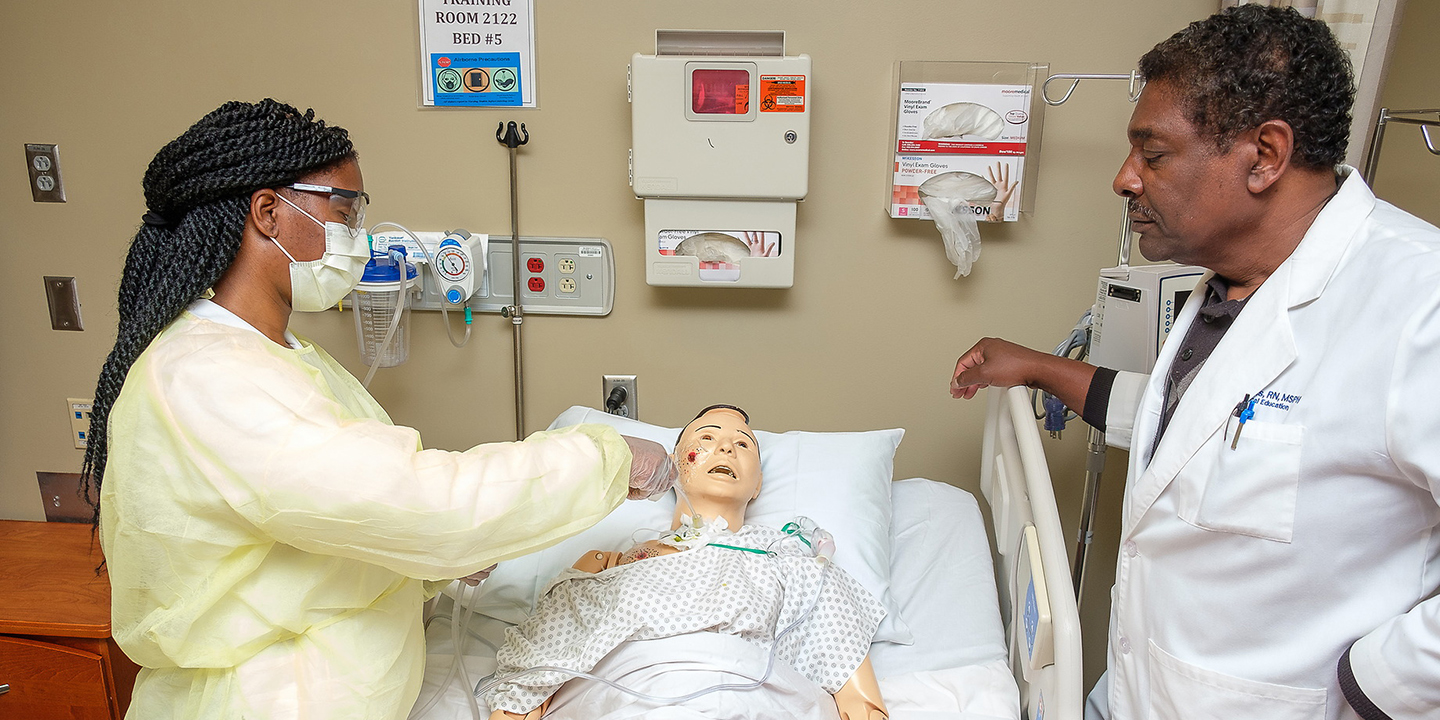 Student and Professor working on labs