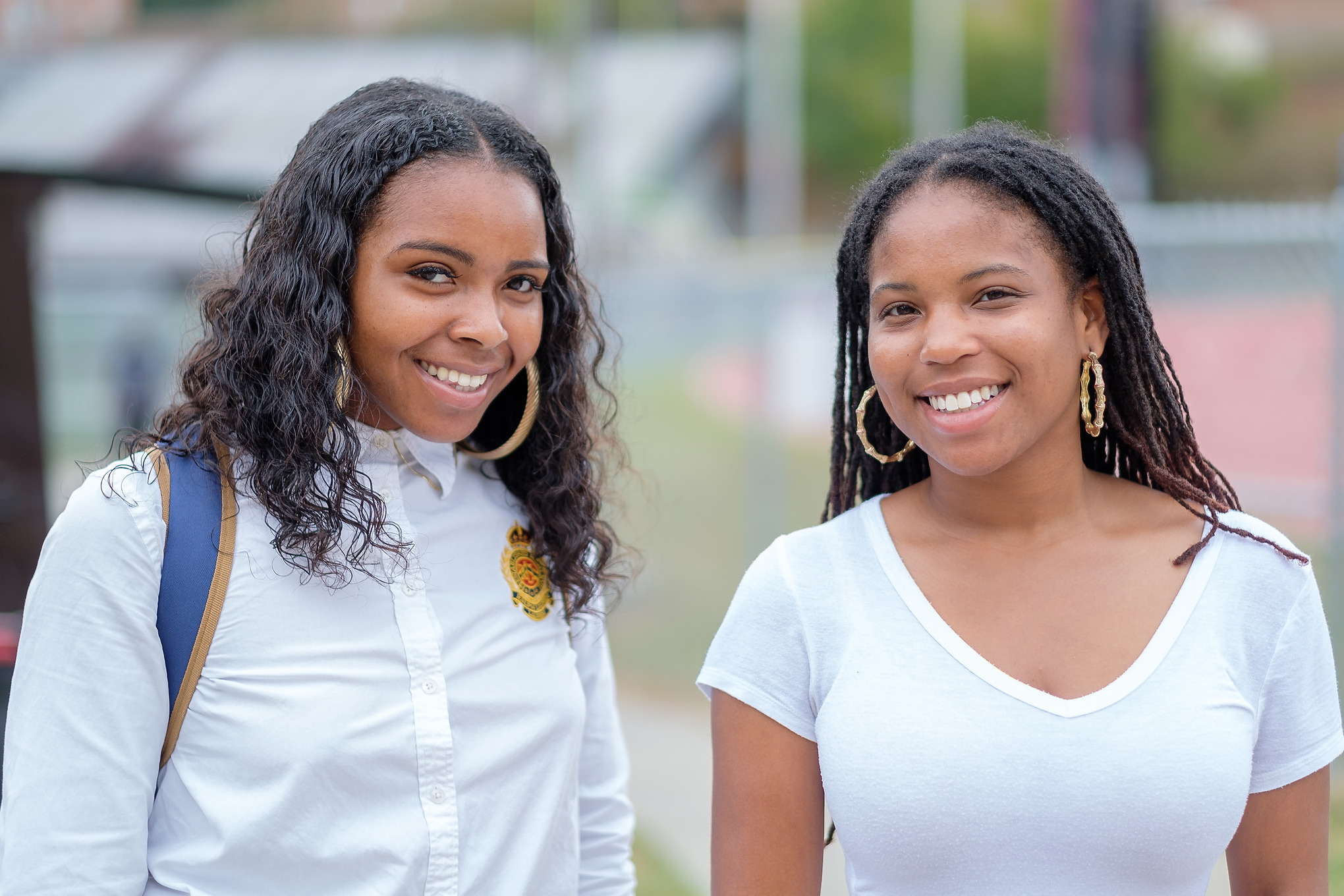 Two students smiling at camera