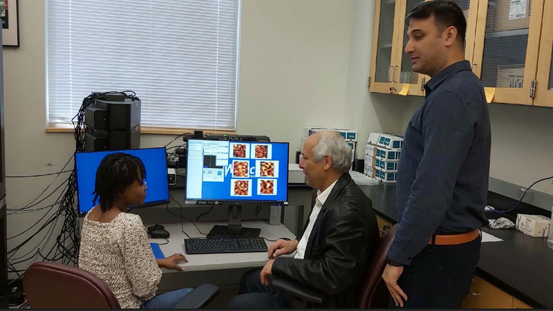 Dr. Akram teaches Ruth  Oluwatoyin, a graduate student, the characterization of piezoelectric and ferroelectric materials.