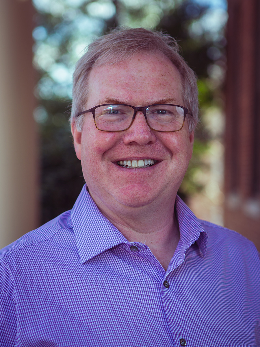 Dr. Kevin Williams in blue button down shirt