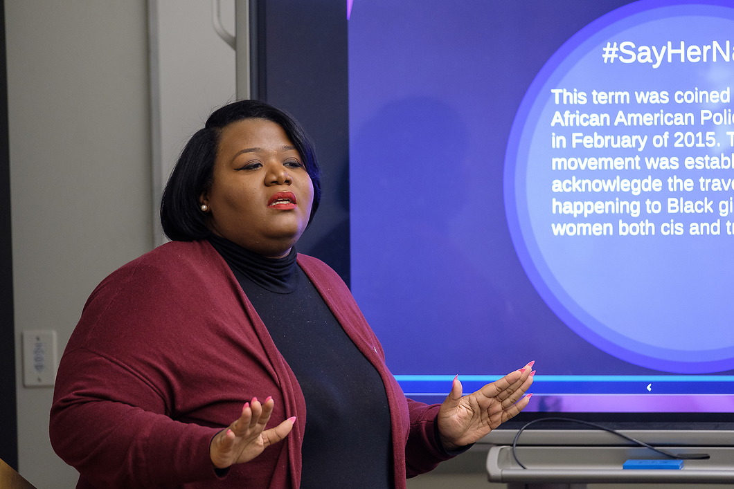 Woman speaking at Women & Gender Studies Symposium