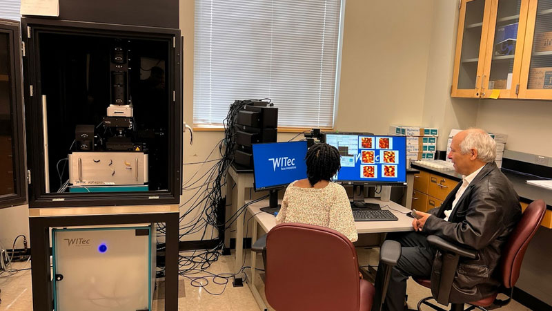 Dr. Karoui training students on Scanning Confocal Raman spectroscopy