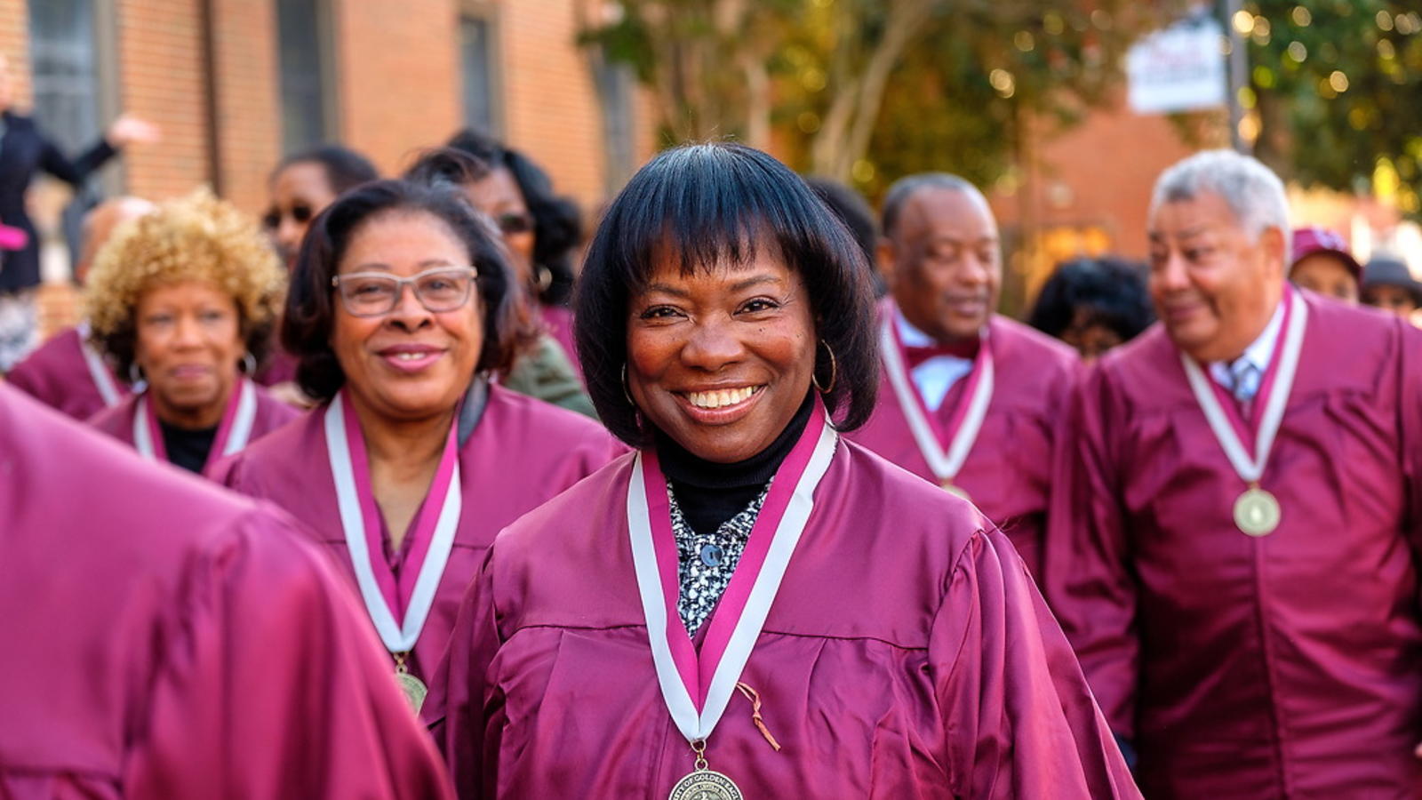 The silver class of 1995-1996 wearing silver medallions