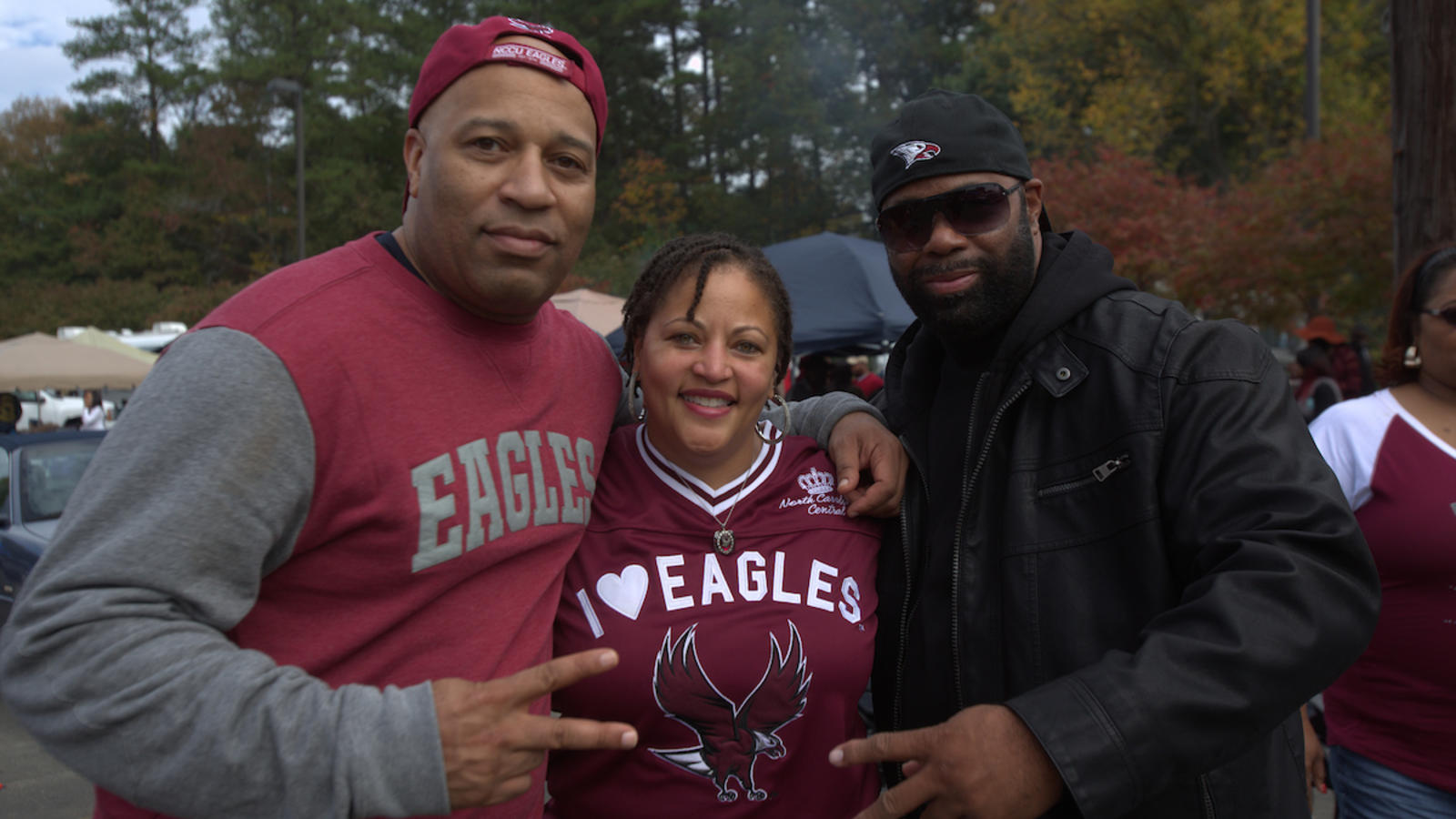 Three Alumni posing for a picture together