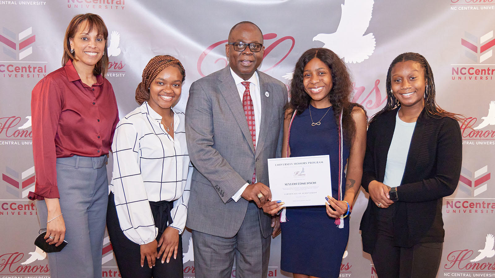 Dr. Jackson and UHP members posing with Chancellor Akinleye