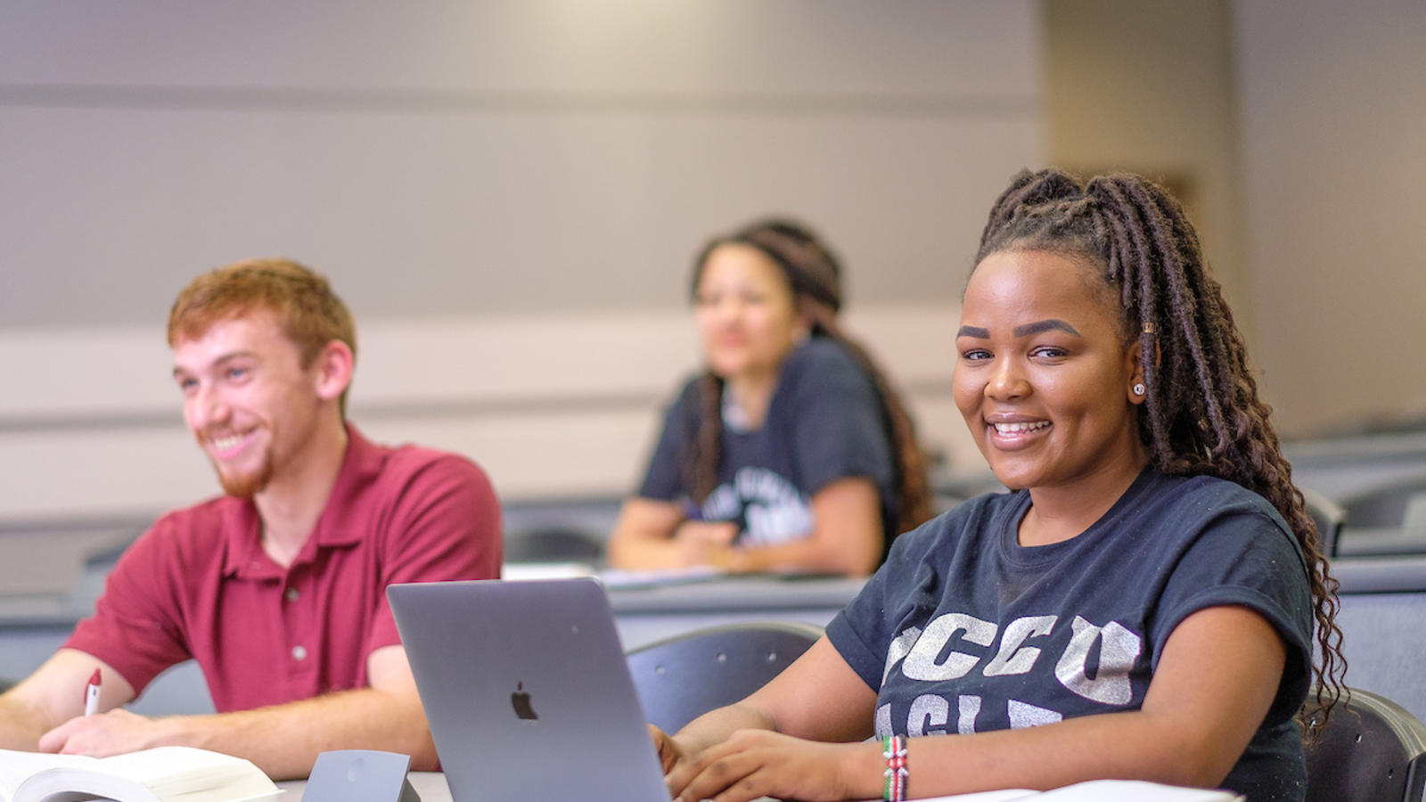 Picture of a student with a laptop