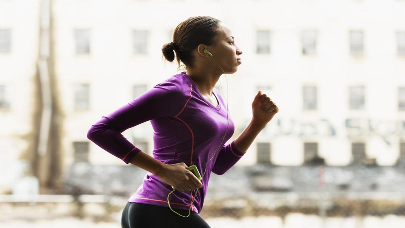 Lady running in purple shirt