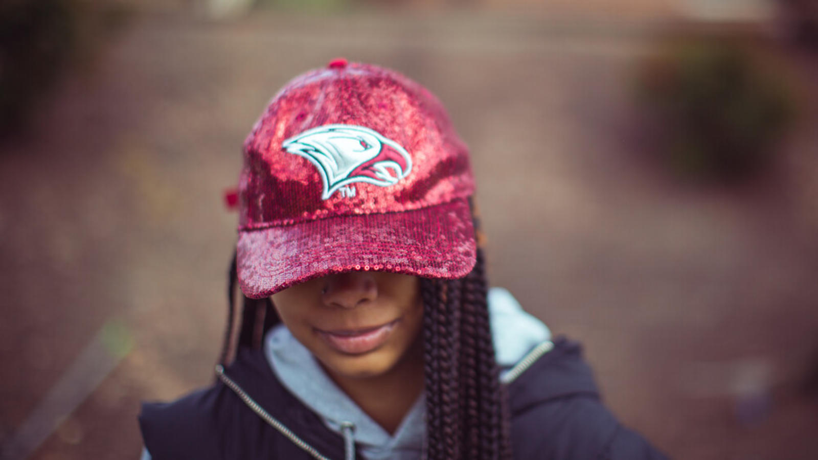 girl in maroon cap
