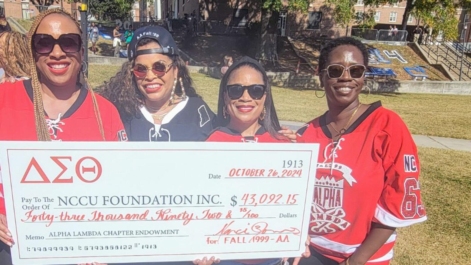 Fall 99 Women of Delta Sigma Theta Sorority have Check donation to Institutional Advancement