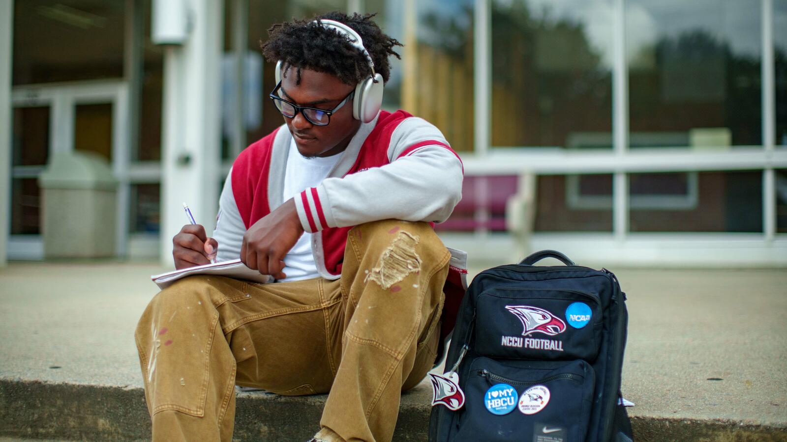A NCCU student taking notes