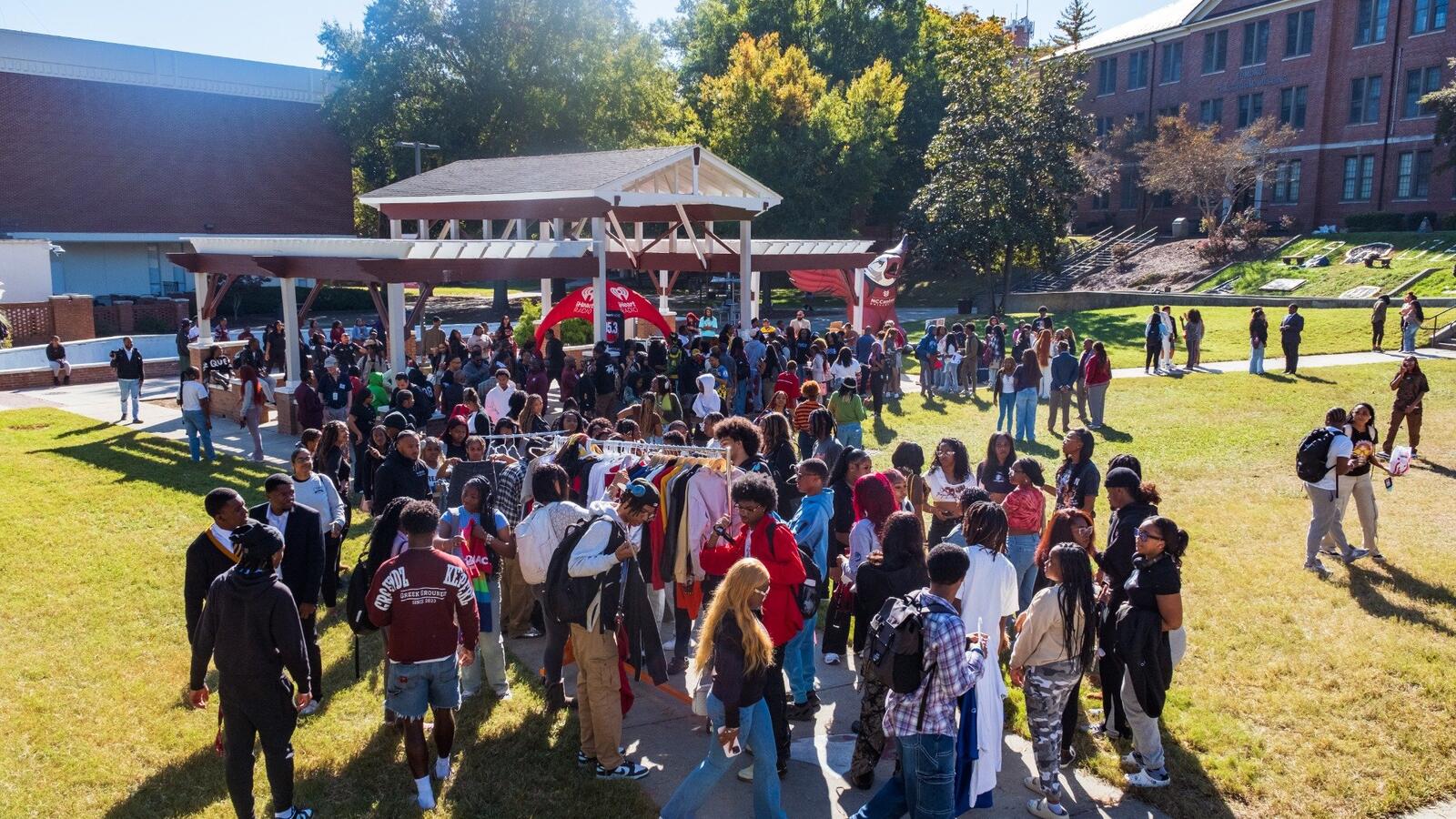 Large group of students gathered outdoors at a campus event