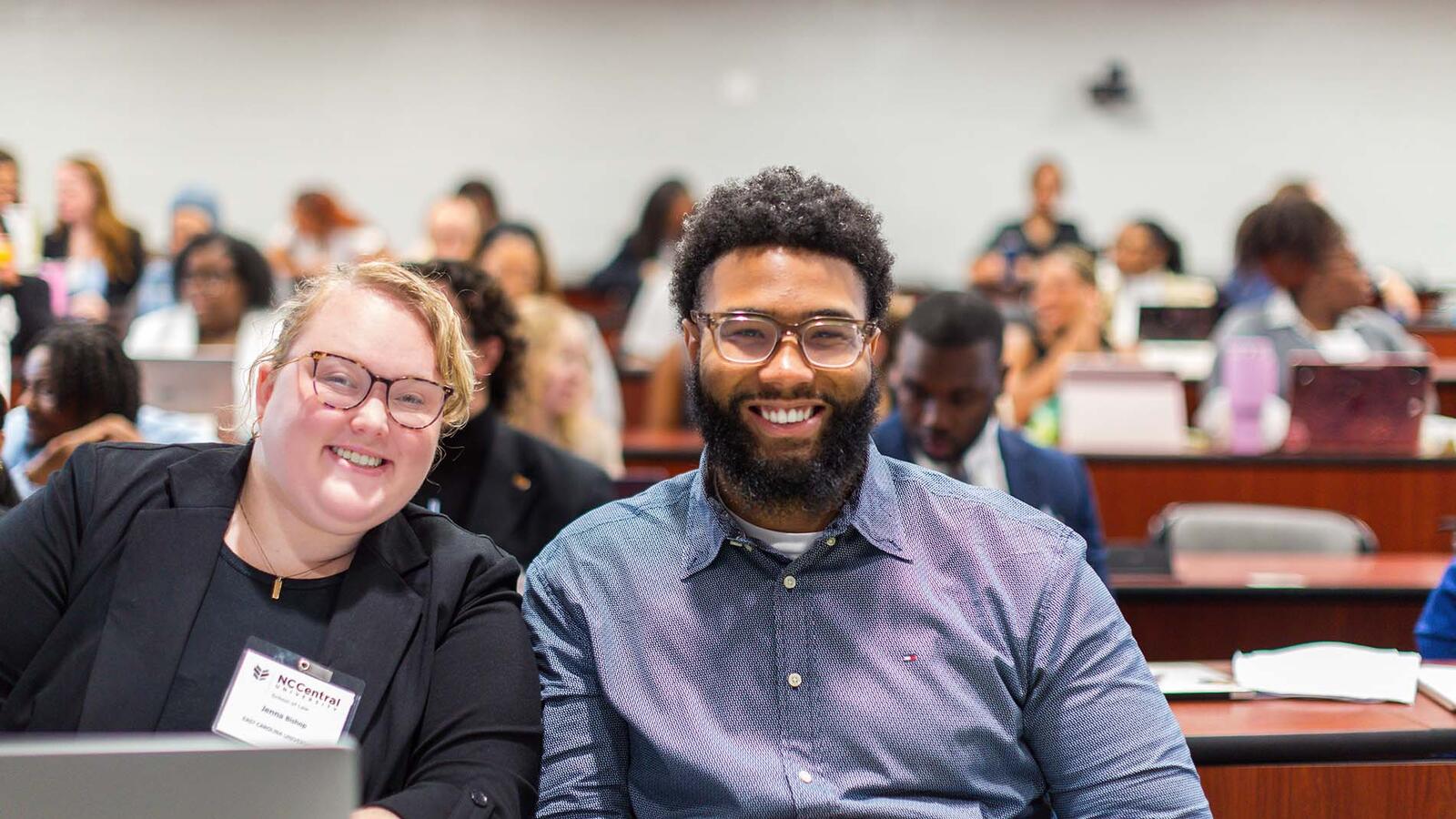 two people smiling