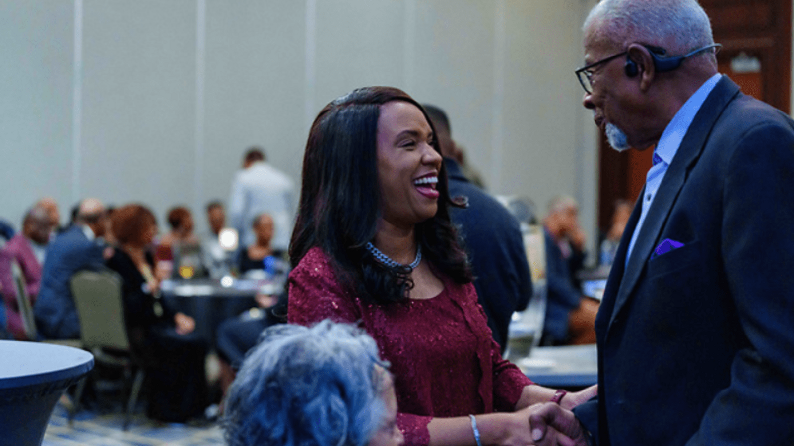 Photo of two people shaking hands at a nccu reception.
