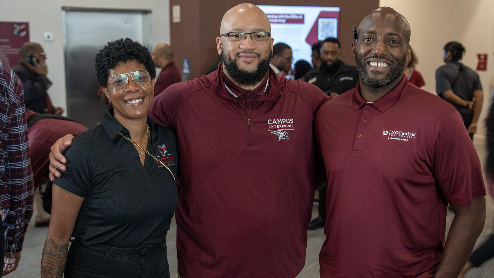 NCCU Campus Enterprises and Academic Affairs staff members posing together at a campus event.