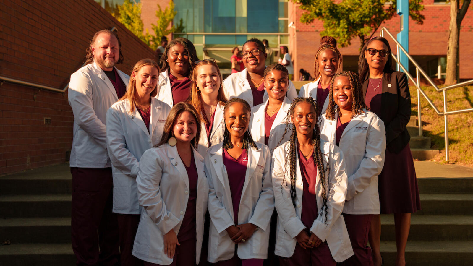 NCCU Nursing students in white coats smiling for the camera