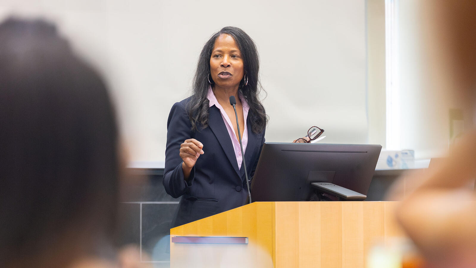 Speaker behind a podium
