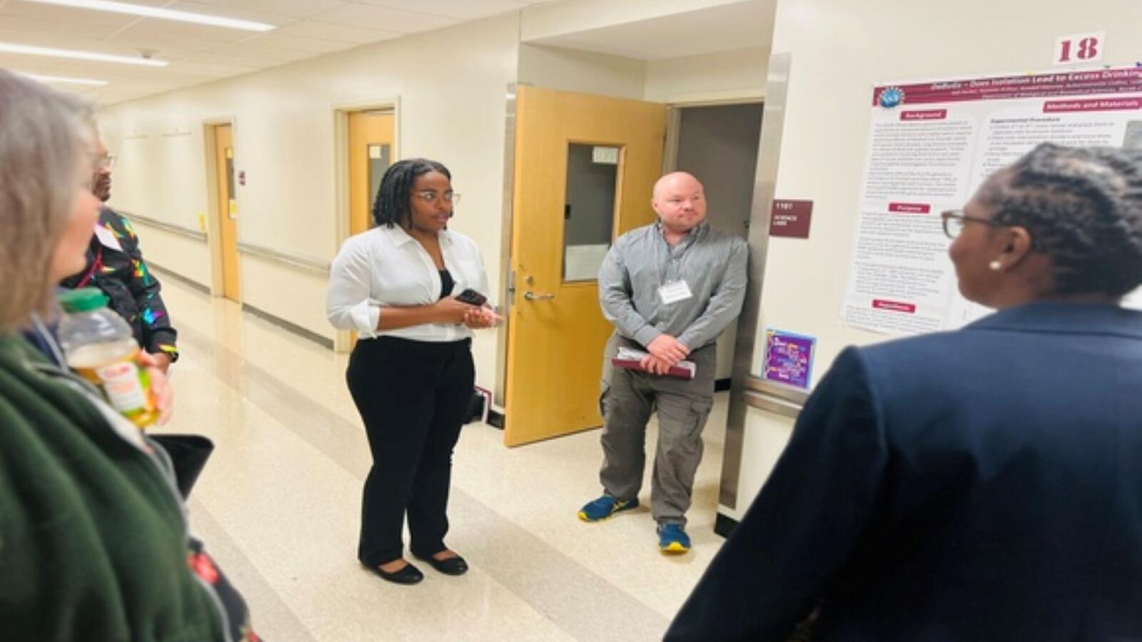 People standing in hallway