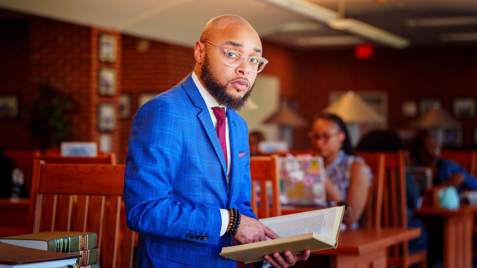 Aaron Gordon in blue suit with book