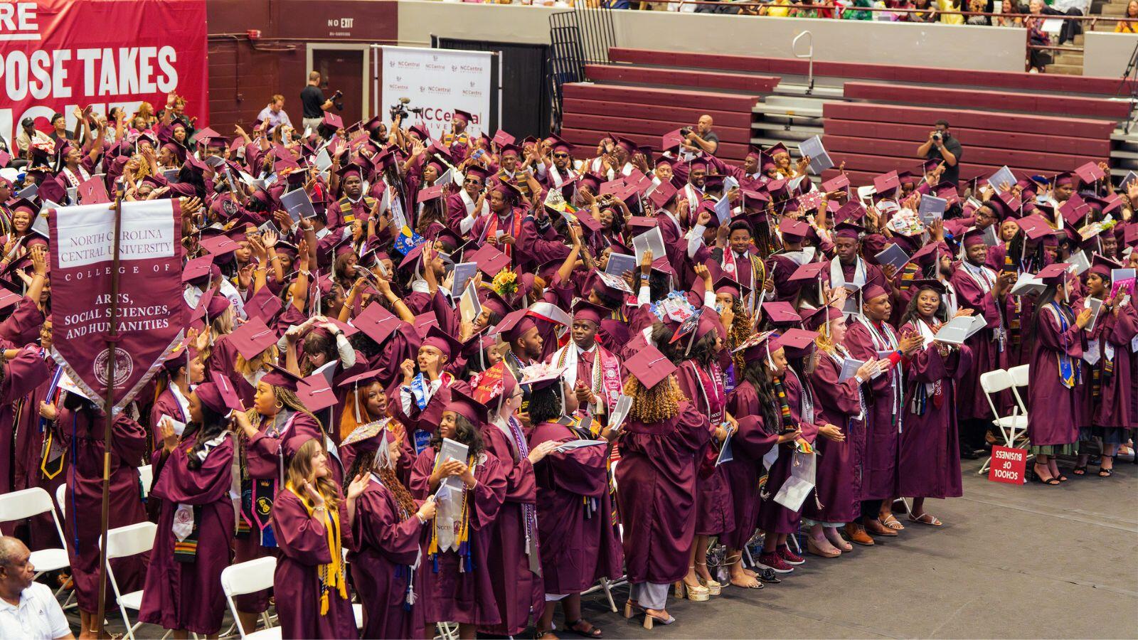 North Carolina Central University 147th Commencement Exercises undergraduate ceremony flyer featuring graduate in maroon regalia, May 9, 2026 with ceremony times at McDougald-McLendon Arena.