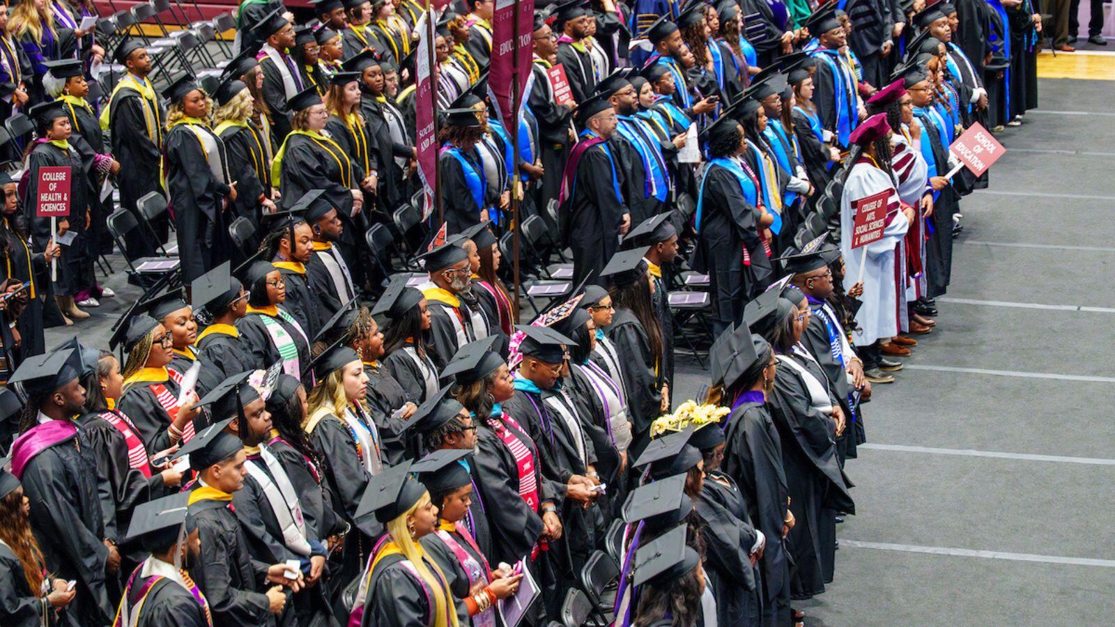 North Carolina Central University 147th Commencement Exercises graduate ceremony flyer with smiling graduate in cap and gown, May 8, 2026 at McDougald-McLendon Arena.