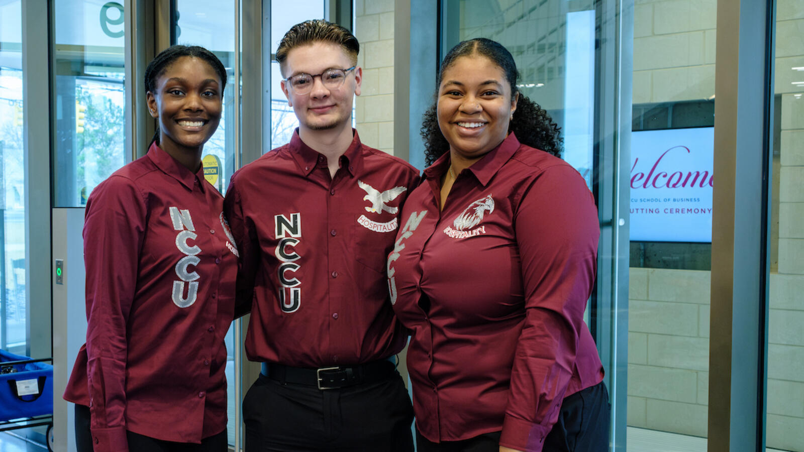 Students in maroon shirts at School of Business